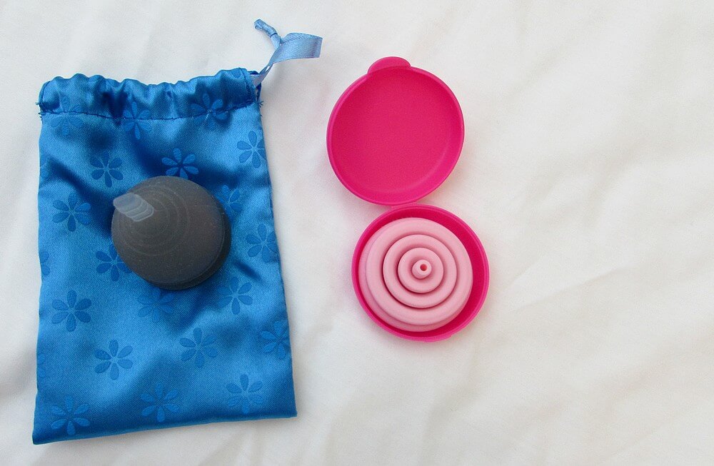Photo of two (one blue, one pink) menstrual cups