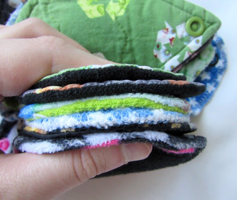 Photo of cloth pad pantyliners pressed together to show the thickness