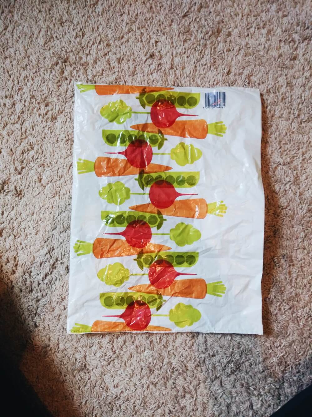 Aldi grocery bag flipped over, green bar facing down