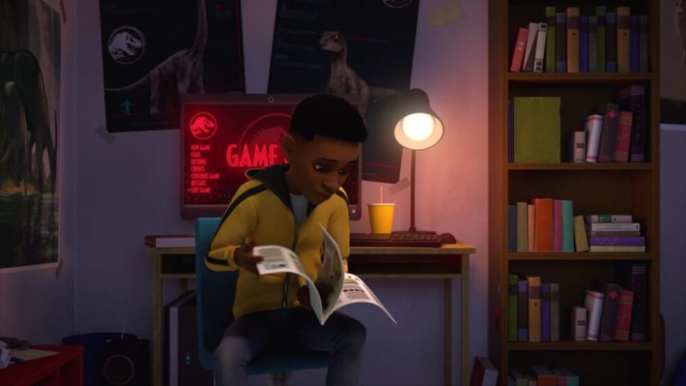 Darius flips through a magazine at his desk