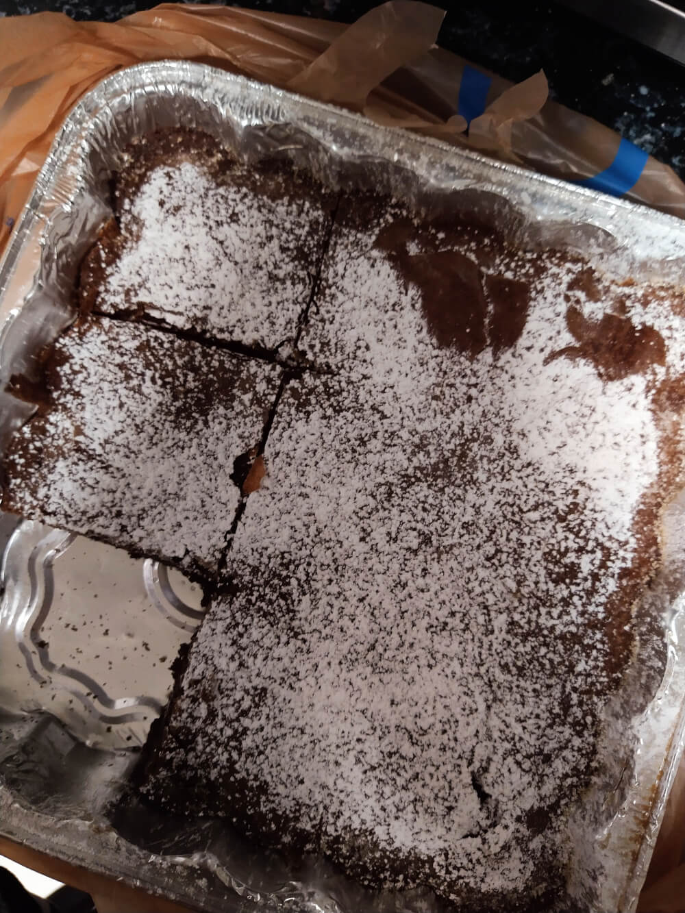 Pan of brownies with powdered sugar