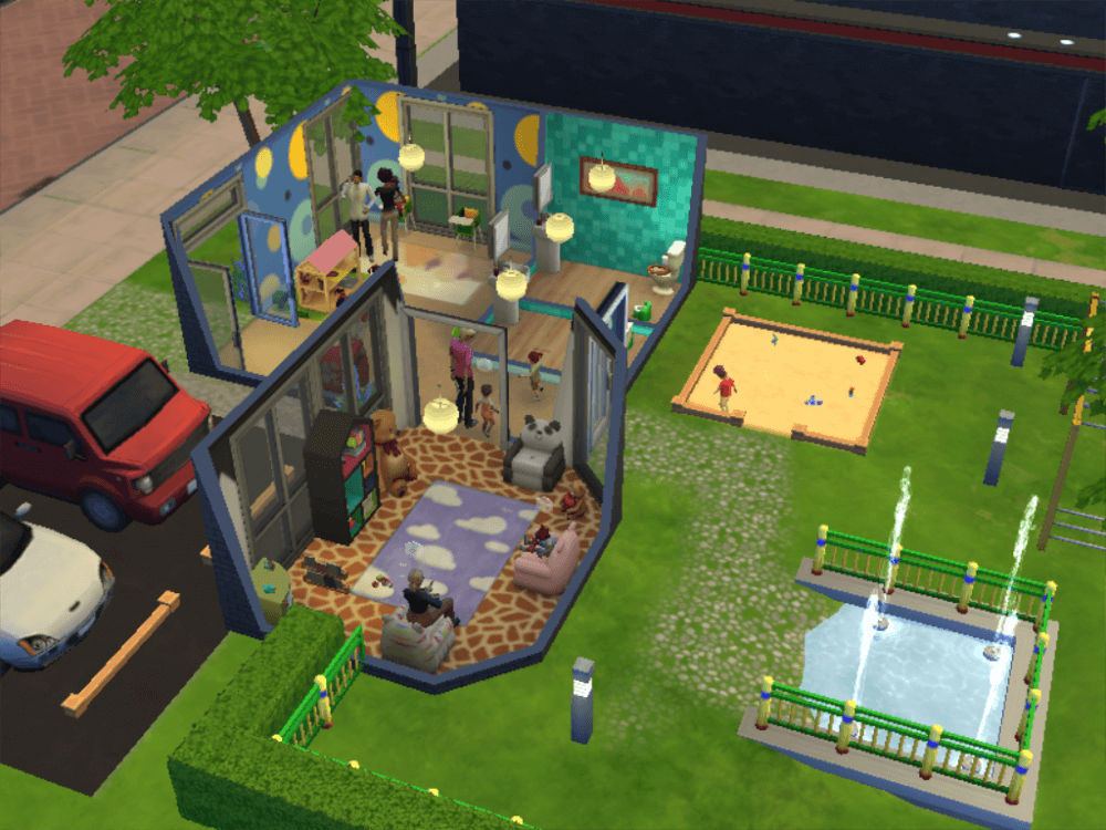 Toddler playground ft. a reading room with chairs and toys, two family bathrooms, a faux sandbox and a toddler pool