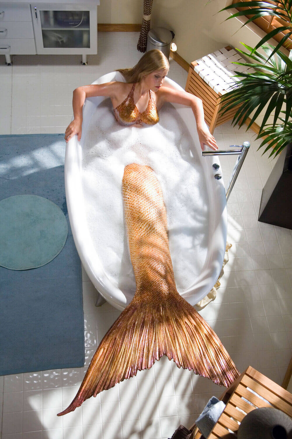 Emma in her mermaid form while in a bubble bath