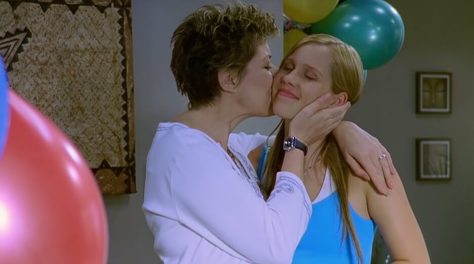Emma's mum kisses her cheek